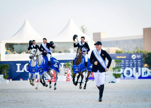 Tom Tarver-Priebe, Bruce Goodin, Daniel Meech and Richard Gardner celebrate New Zealand's victory in the Longines FEI Jumping Nations Cup of the United Arab Emirates at Abu Dhabi. (©FEI/Helen Cruden)